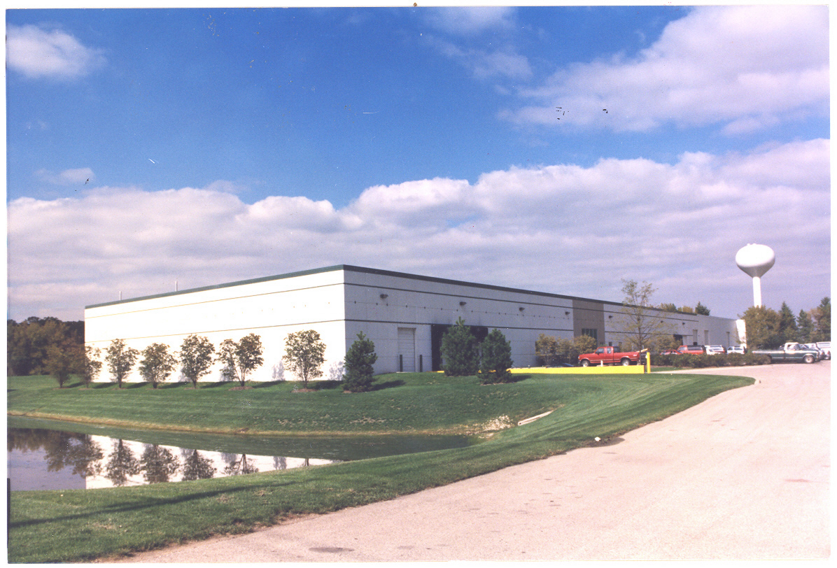 An industrial manufacturing and warehousing facility. The structural system consists of precast concrete bearing wall planks, steel column and girder framing, and steel bar joist roof framing. Structural spans are 40’ x 40’ and several truck docks with dock levelers are included.