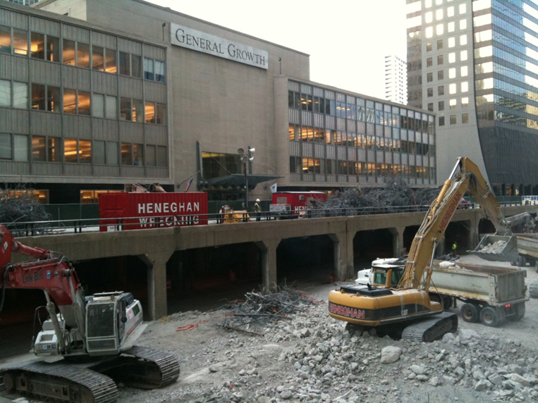 Large scale demolition project requiring specialized structural engineering services for load analysis of heavy equipment on existing raised roadway and logistical sequencing strategies.