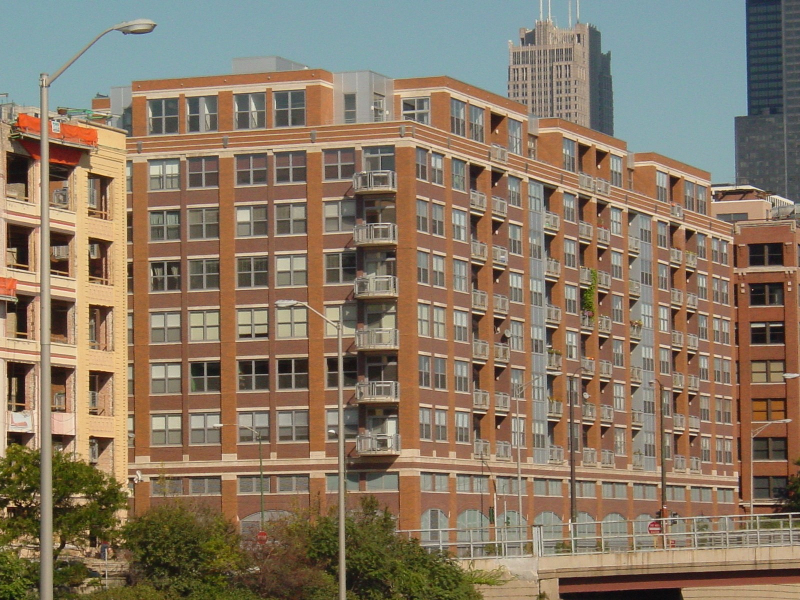 New construction 11-story precast concrete structure with amenity spaces, large roof terrace and balconies on deep caisson foundations.